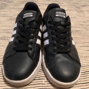 Women’s Adidas black shoes with white stripes